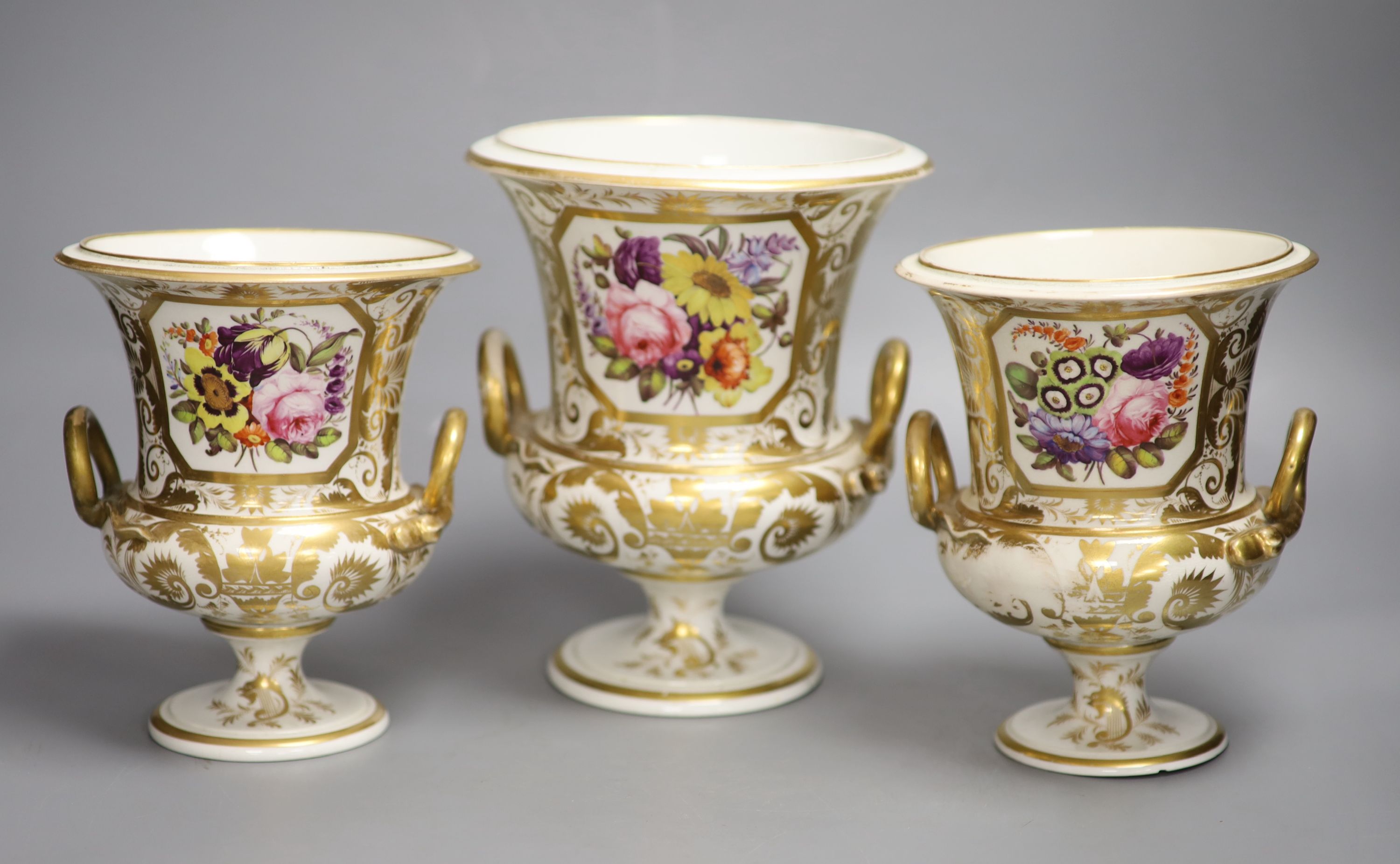 A pair of Derby gilt and floral decorated vases and another similar vase, tallest 19cm